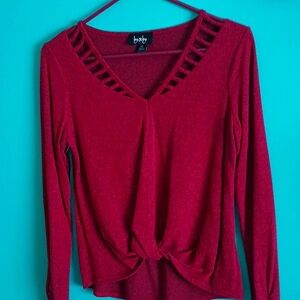 Jr XS, V-Neck sweater, Red with black accents throughout.